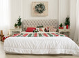 Front view of king size decorated bed for Christmas holidays.