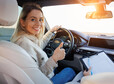 Happy Learner Driver Giving Thumbs Up During Driving Lesson